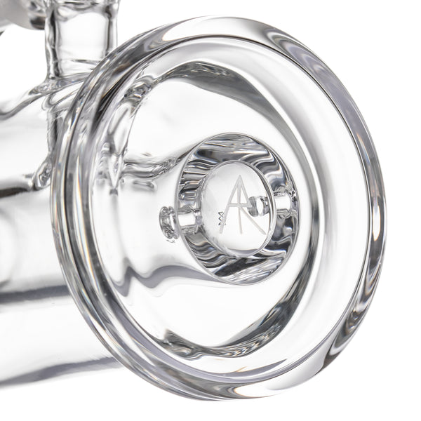 Close-up of Column Mini Dab Rig - Clear, showcasing thick-walled borosilicate glass with etched A logo on cylindrical nub, highlighting premium craftsmanship.