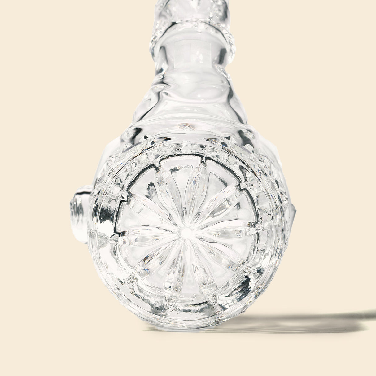 Highball Pipe featuring a clear-glass decanter design with a decorative starburst base, tapering neck, and stoppered top, showcasing hand-blown craftsmanship and intricate detailing.