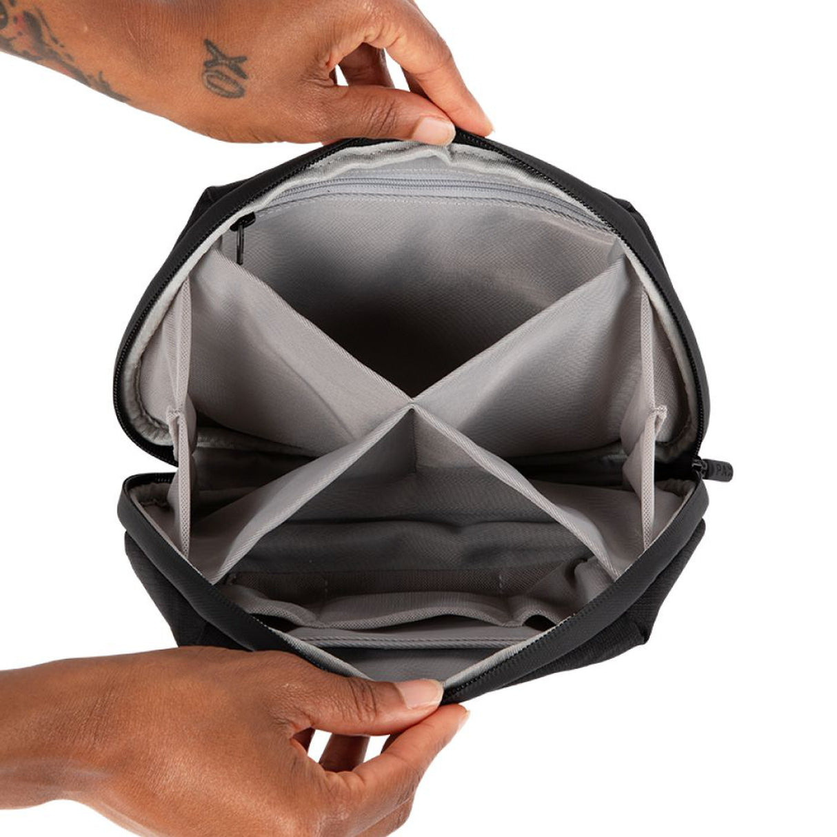 PAX Smell Proof Bag - Medium, shown being held, designed for discreet cannabis storage with smell-proof technology, customizable dividers, and water-resistant material.