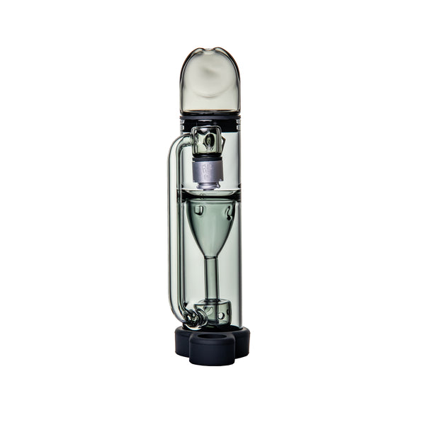 Ryan Fitt Pillar Pivot Top - Smoke: Compact glass bubbler with cylindrical chamber, funnel perc, vertical downstem, rounded mouthpiece, triple silicone stabilizers; fits Puffco Pivot.