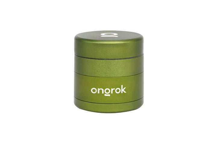 Mini EZ Grinder - 55mm, a compact, cylindrical three-piece metal grinder with ongrok branding, designed for efficient spice grinding with a magnetic lid and deep chambers.