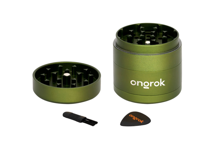 Mini EZ Grinder - 55mm, featuring a three-part anodized-metal body, magnetic lid, triangular teeth, collection chamber, cleaning brush, and scraper for efficient herb grinding.