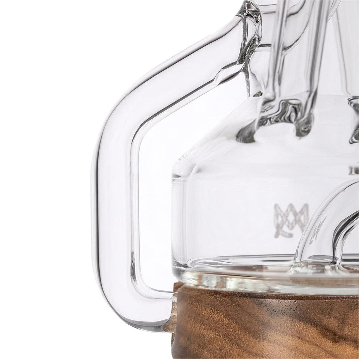 Close-up of the Apex Mini Rig from the Alpine Collection, highlighting its clear glass handle, inner chamber, and wood-accented base, showcasing its elegant design.