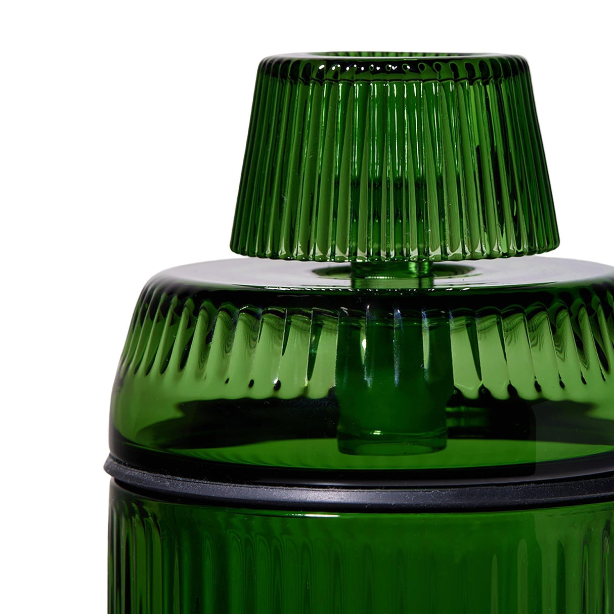 Deco Gravity Bong close-up showing green ribbed translucent vessel with fluted knob, circular sealing lip, and matching lid, highlighting Art Deco-inspired design and modern functionality.