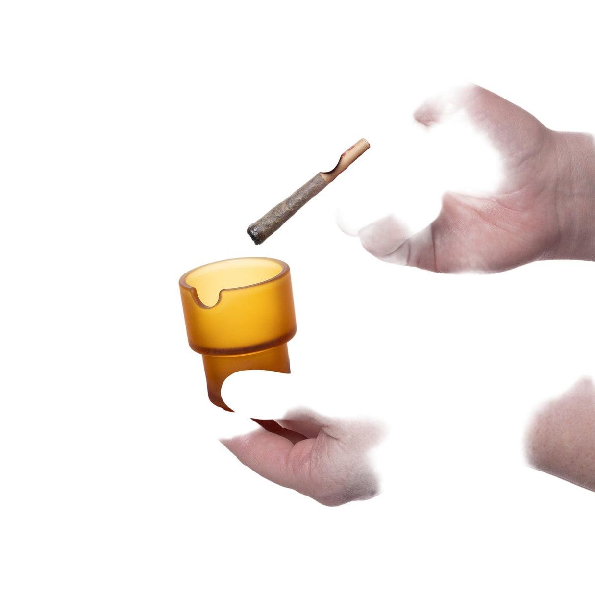 Hand holds the amber Flower Pots Ashtray, showcasing its cylindrical design; a spent joint hovers above, highlighting its functional art elegance.