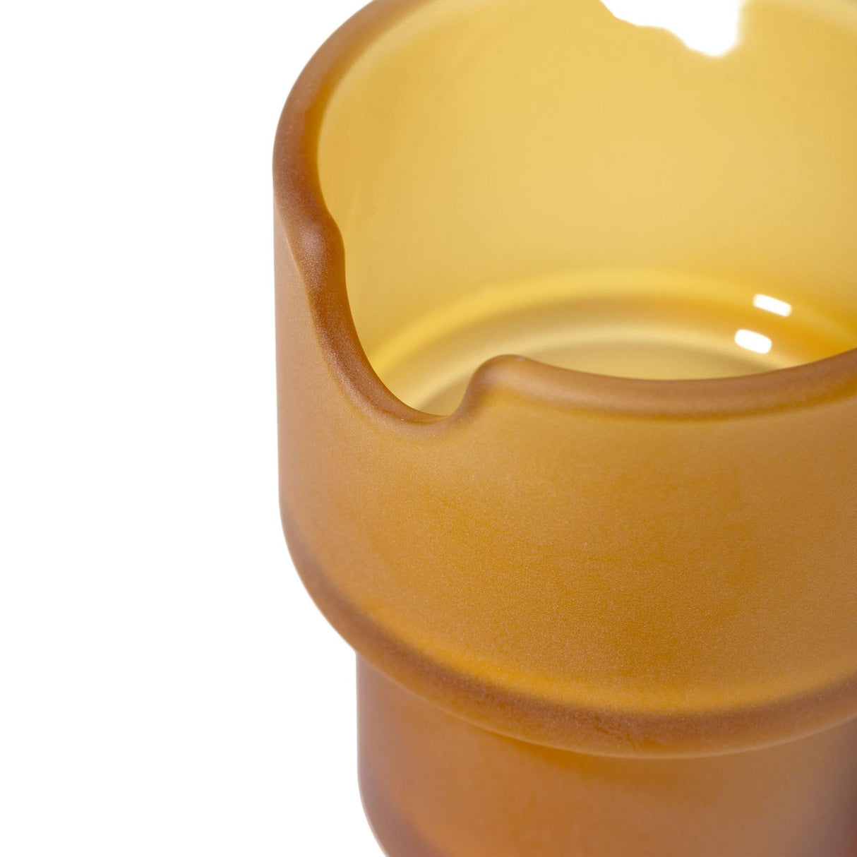 Close-up of the NWTN Home Flower Pots Ashtray, showcasing its amber-yellow frosted glass with a semi-circular notch, highlighting its elegant, sculptural design.