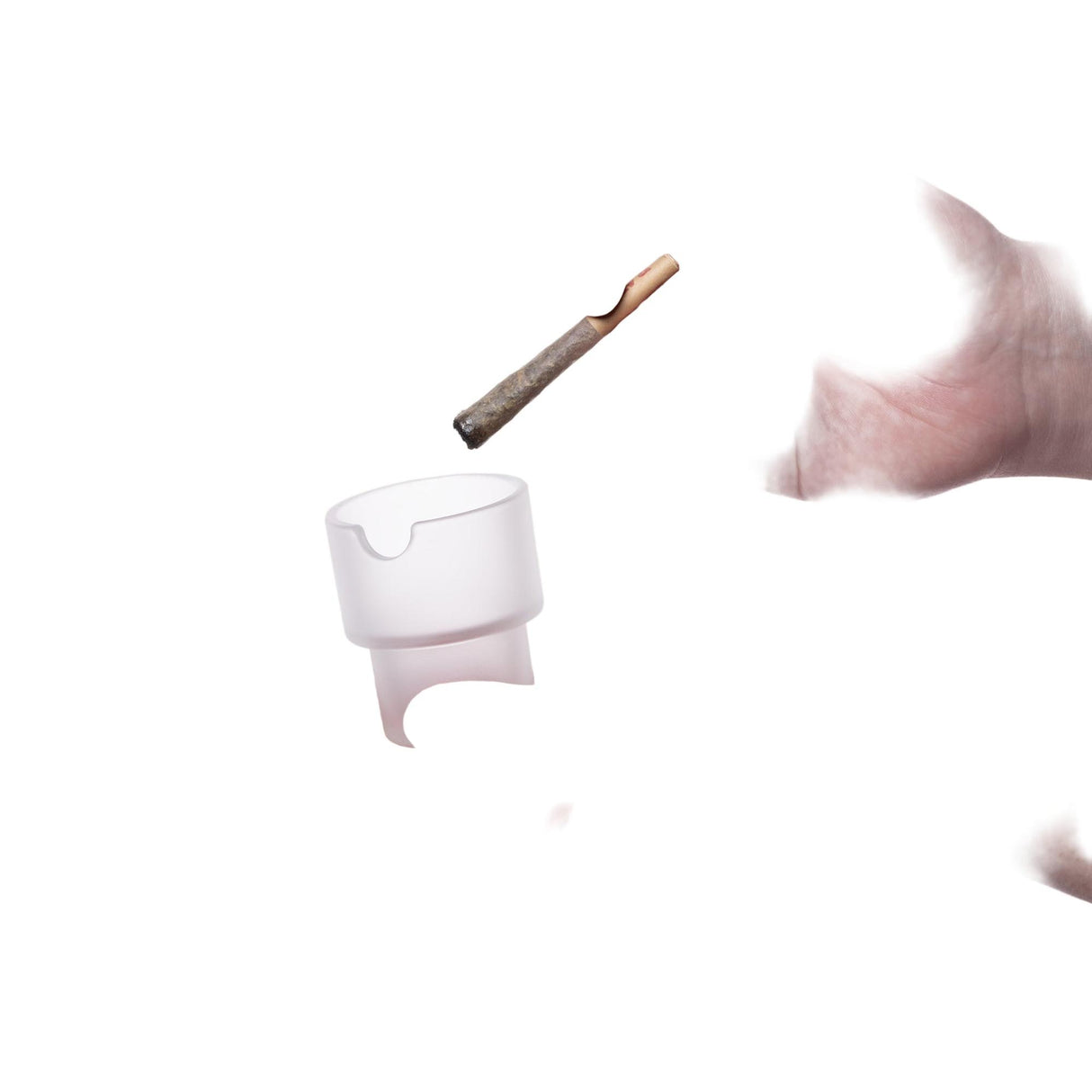Flower Pots Ashtray Set: A partially burned joint and a small, translucent ashtray with a notch, showcasing functional art for modern spaces.