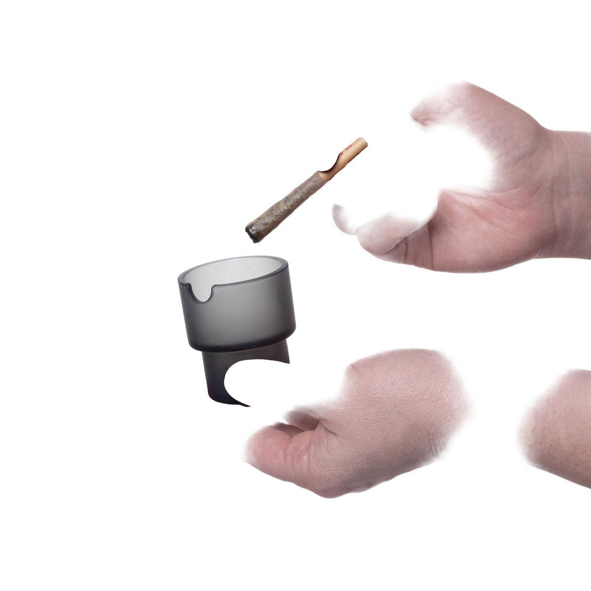 Hands presenting the Flower Pots Ashtray Set, a small, translucent gray-smoked accessory with a notch for a cigarette, showcasing its minimalist, functional design.