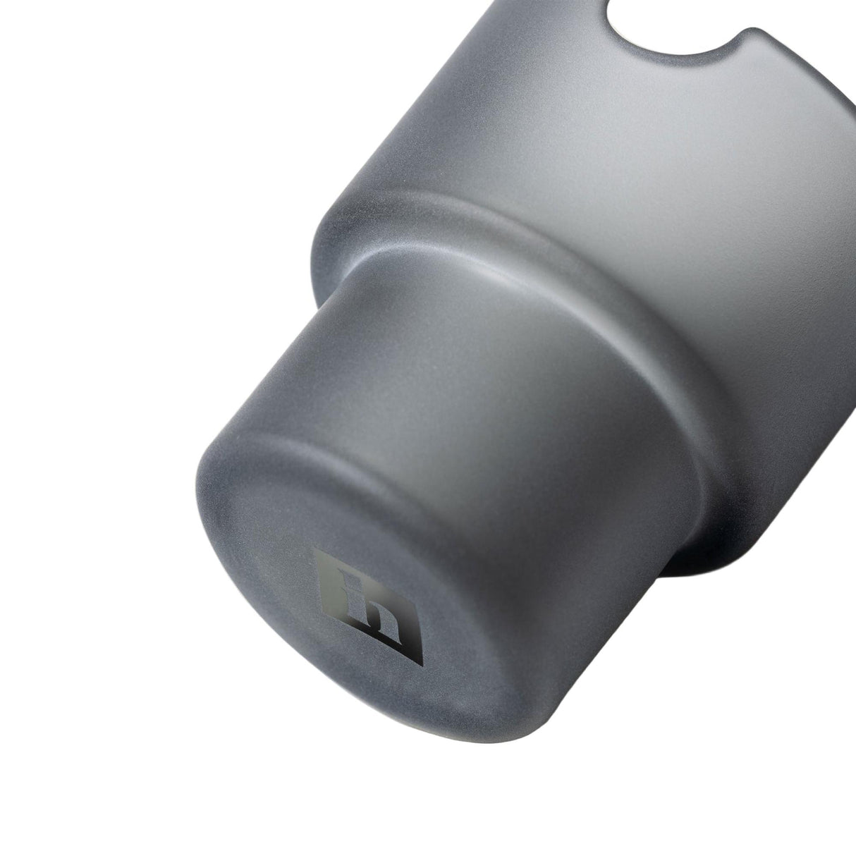 Close-up of the Flower Pots Ashtray Set, showcasing a grey, machined metal socket with a stepped-cylinder shape and H logo etched on the end face.