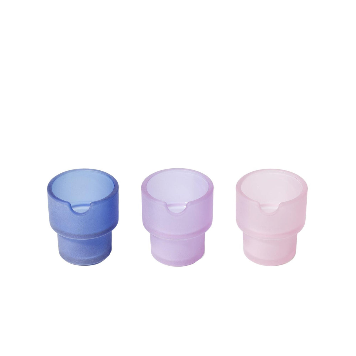 Flower Pots Ashtray Set: Three semi-translucent cylindrical glass vessels with U-shaped notches, showcasing minimalist design and textured sandblasted exteriors against a plain backdrop.