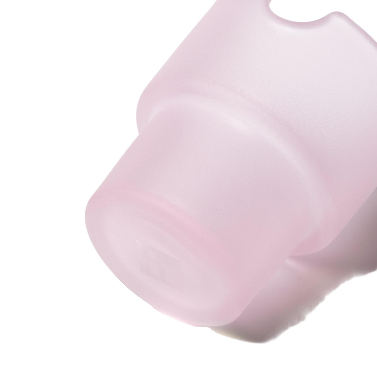 Close-up of a pale-pink silicone sleeve, part of the Flower Pots Ashtray Set, highlighting its cylindrical base and hanging loop for functional, minimalist décor.
