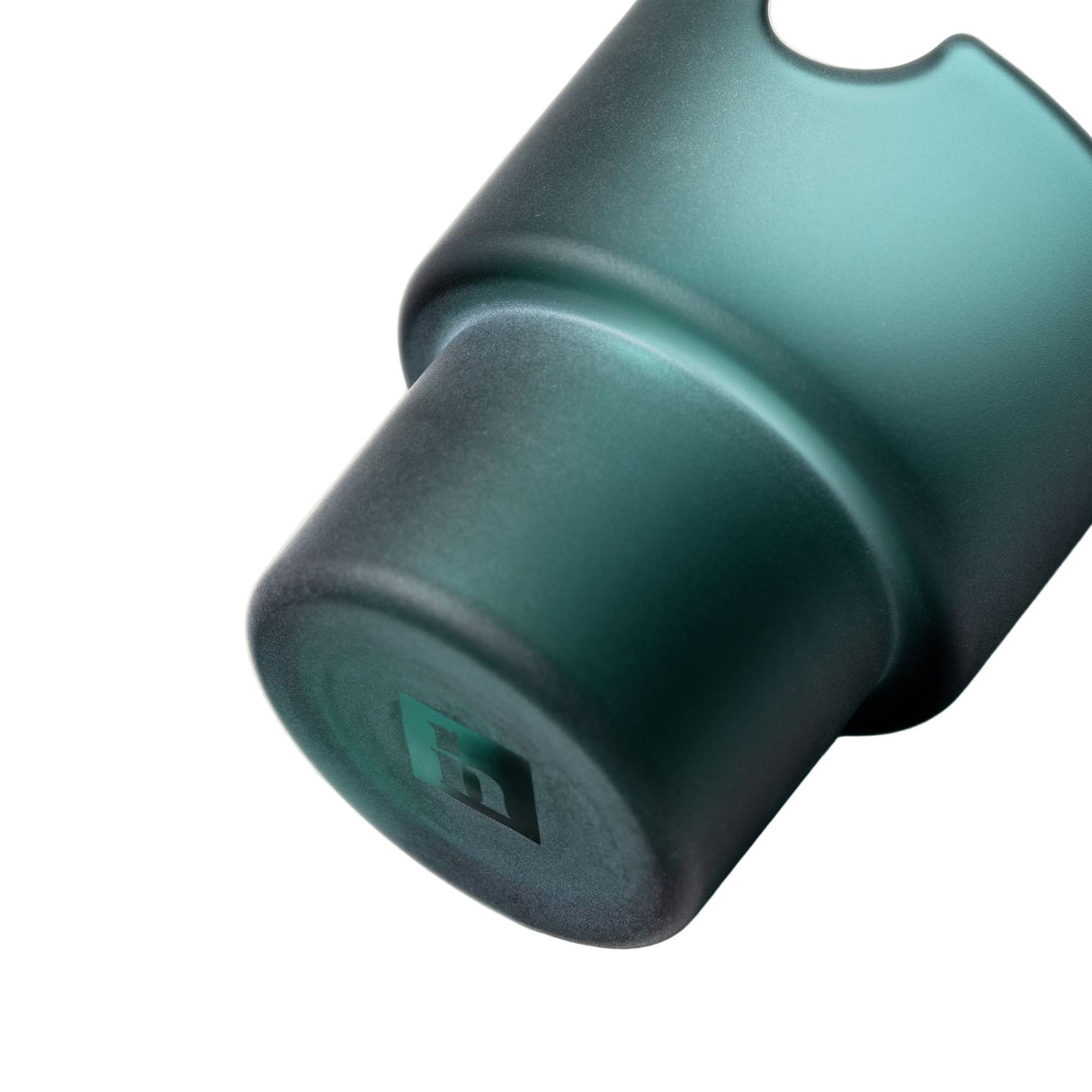 Close-up of Flower Pots Ashtray Set component, showing a teal metal sleeve with an H logo and semi-circular notch, part of a sculptural décor piece.