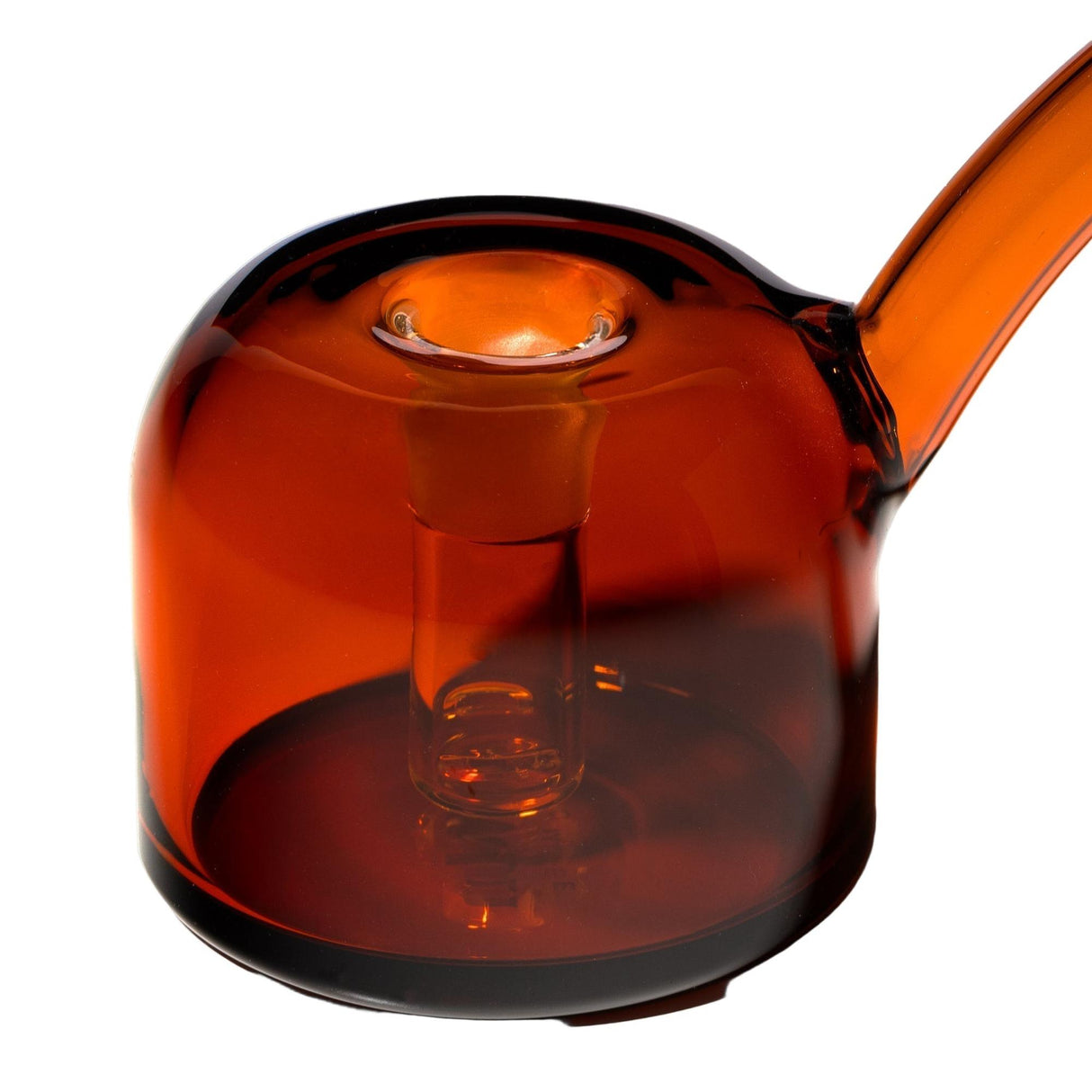 Close-up of the Vesper Bubbler, a cylindrical amber glass centerpiece with a funnel top, side spout, and visible inner tube, showcasing modern elegance and functionality.