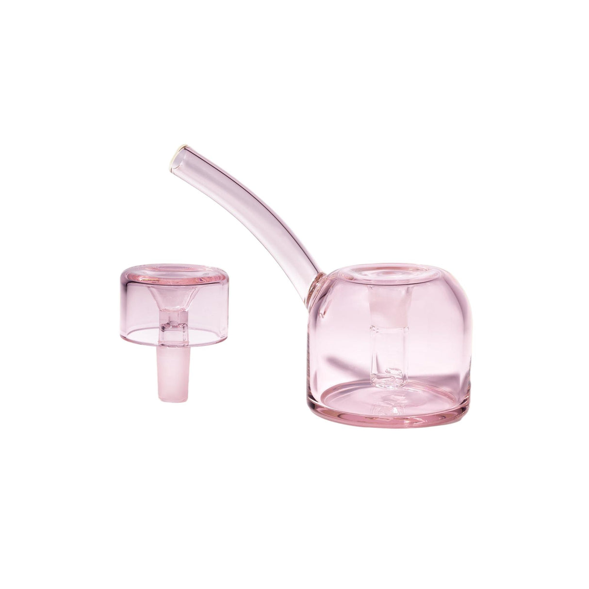 The Vesper Bubbler in translucent pink glass features a sleek, bent mouthpiece and a matching carb cap for controlled airflow and smooth, elegant use.