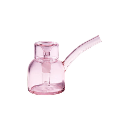 Vesper Bubbler: A compact, all-pink glass water-pipe featuring a round chamber, internal down-stem, and angled mouthpiece, designed for elegant, smooth, water-filtered pulls.