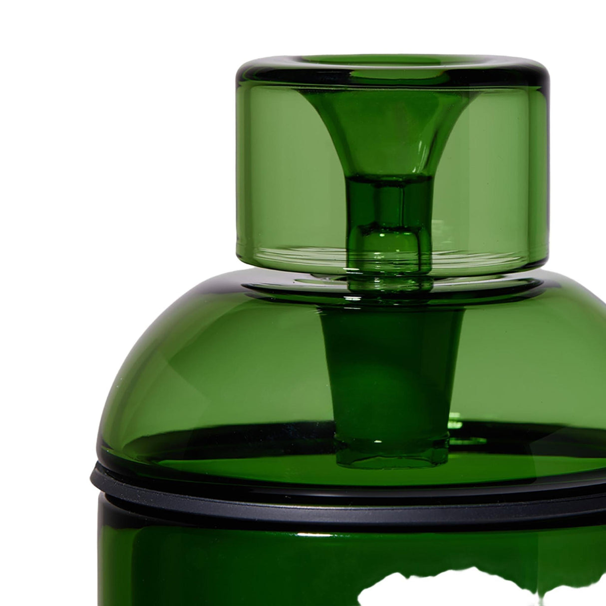 Close-up of the Vesper Gravity Bong's green translucent bottle, featuring a cylindrical lid, central spout, and black sealing ring, showcasing its sleek, modern design.