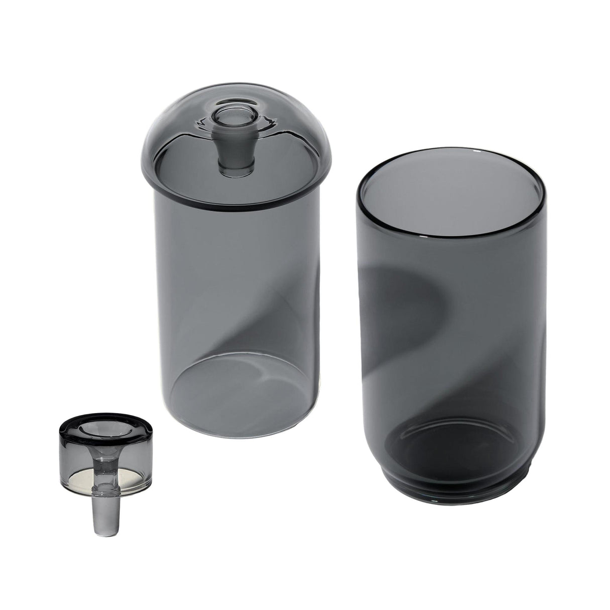 Vesper Gravity Bong, a modular translucent-grey glass set featuring a tall tumbler, domed lid, and stemmed insert, showcasing a sleek, minimalist design for effortless use.