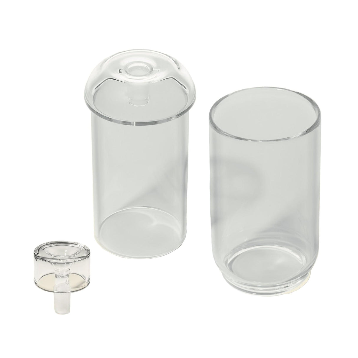 Vesper Gravity Bong: Three clear cylindrical glass pieces, including an open-top jar, a domed-lid cylinder, and a matching cap, showcasing elegant, gravity-powered design.