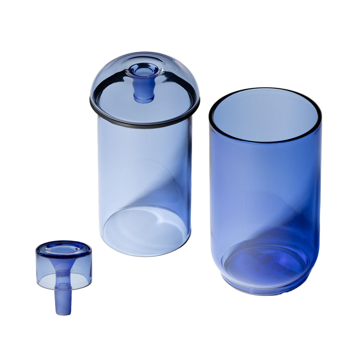 Vesper Gravity Bong showcasing a tall tumbler, shorter lidded cylinder, and funnel, all in translucent blue glass, highlighting its sleek, elegant design.
