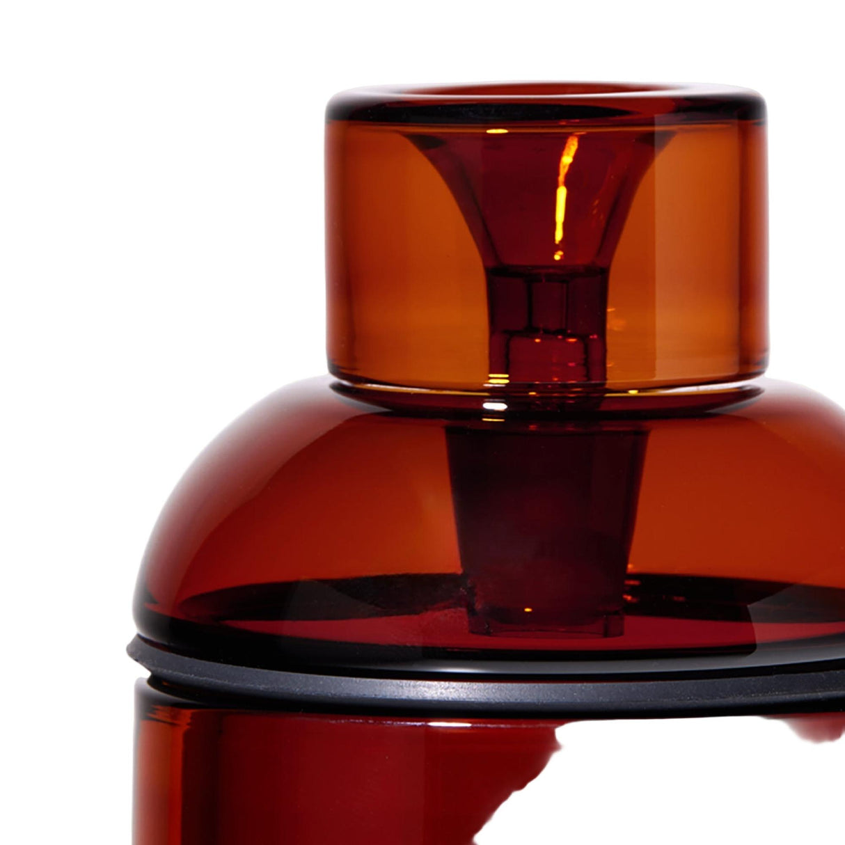 Close-up of Vesper Gravity Bong's tinted amber-orange glass lid, showcasing its elegant cylindrical and domed design with a dark gasket, highlighting its modern, vintage-inspired aesthetic.