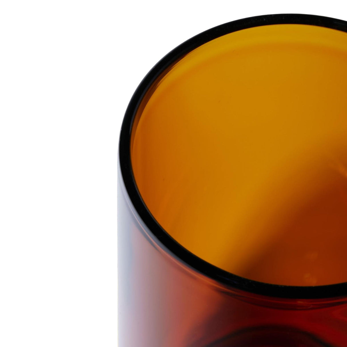 Vesper Gravity Bong close-up, showcasing its smooth, translucent amber cylindrical glass design, highlighting the elegant rim and precision-engineered interior for effortless, powerful pulls.