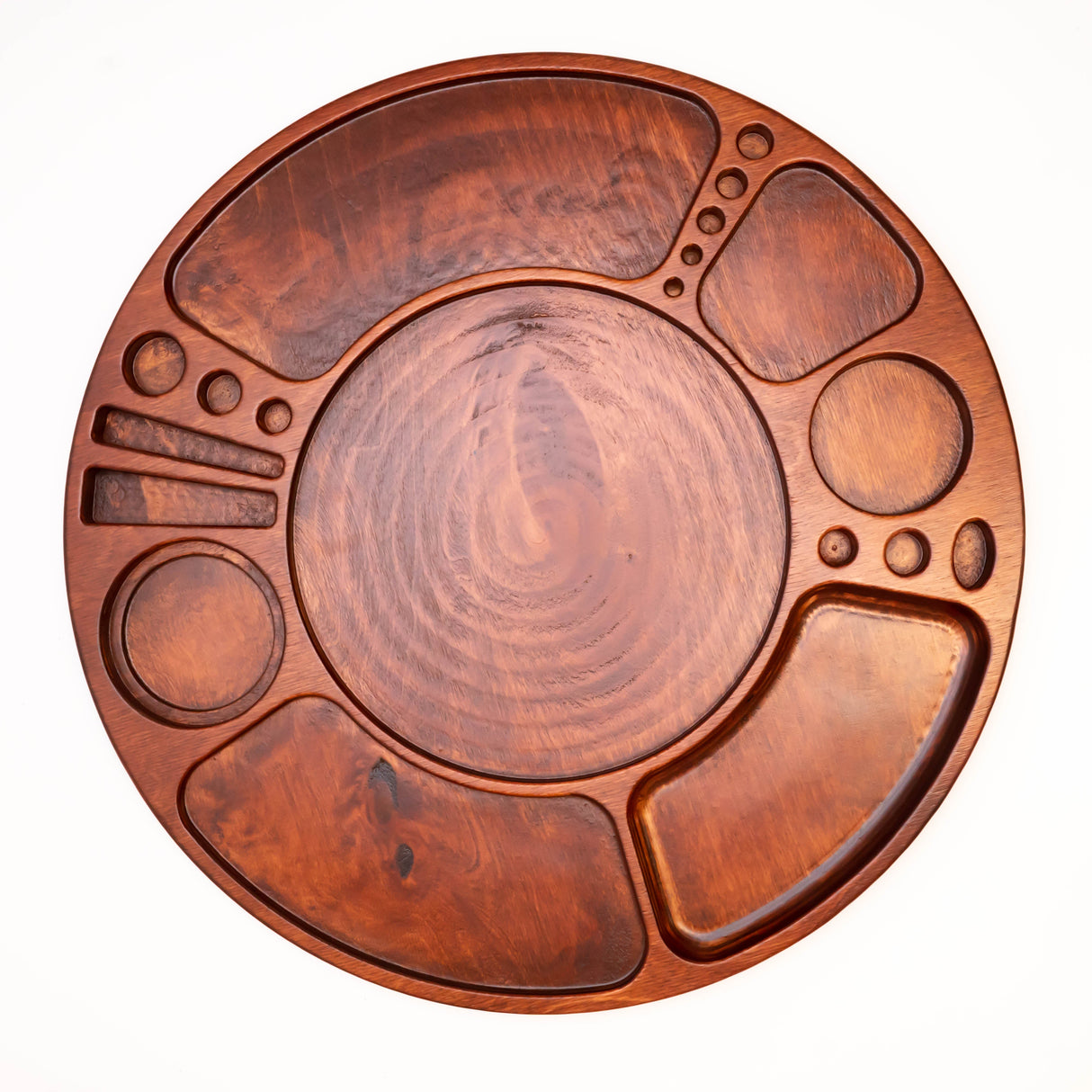 Spinning Rolling Tray: Circular wooden platter with recessed compartments, central well, and rotating base, designed for organized display of various foods or accessories.