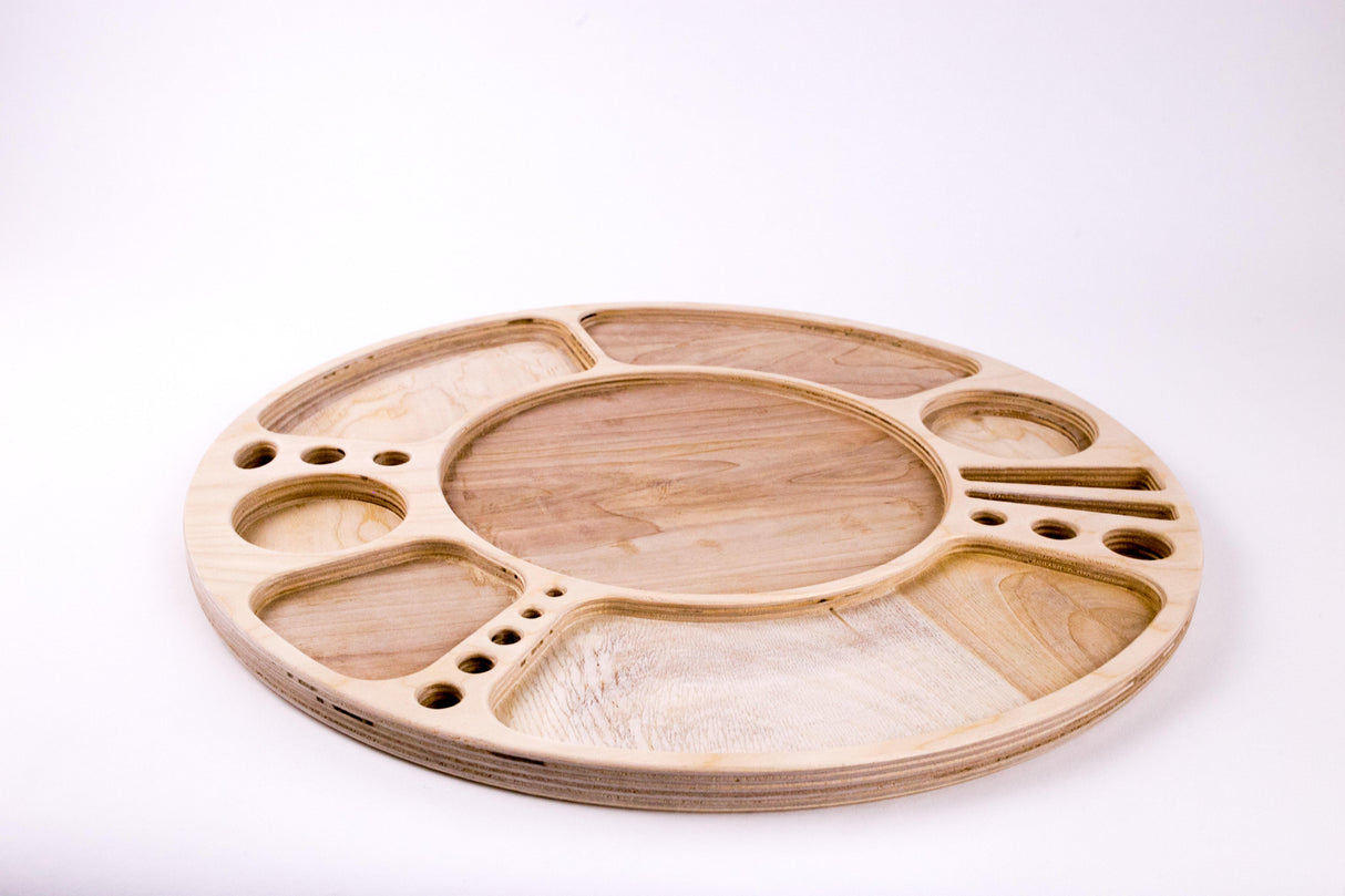 Spinning Rolling Tray showcasing a round wooden design with multiple compartments and a central well, crafted in light wood with a smooth, clear-coated finish.