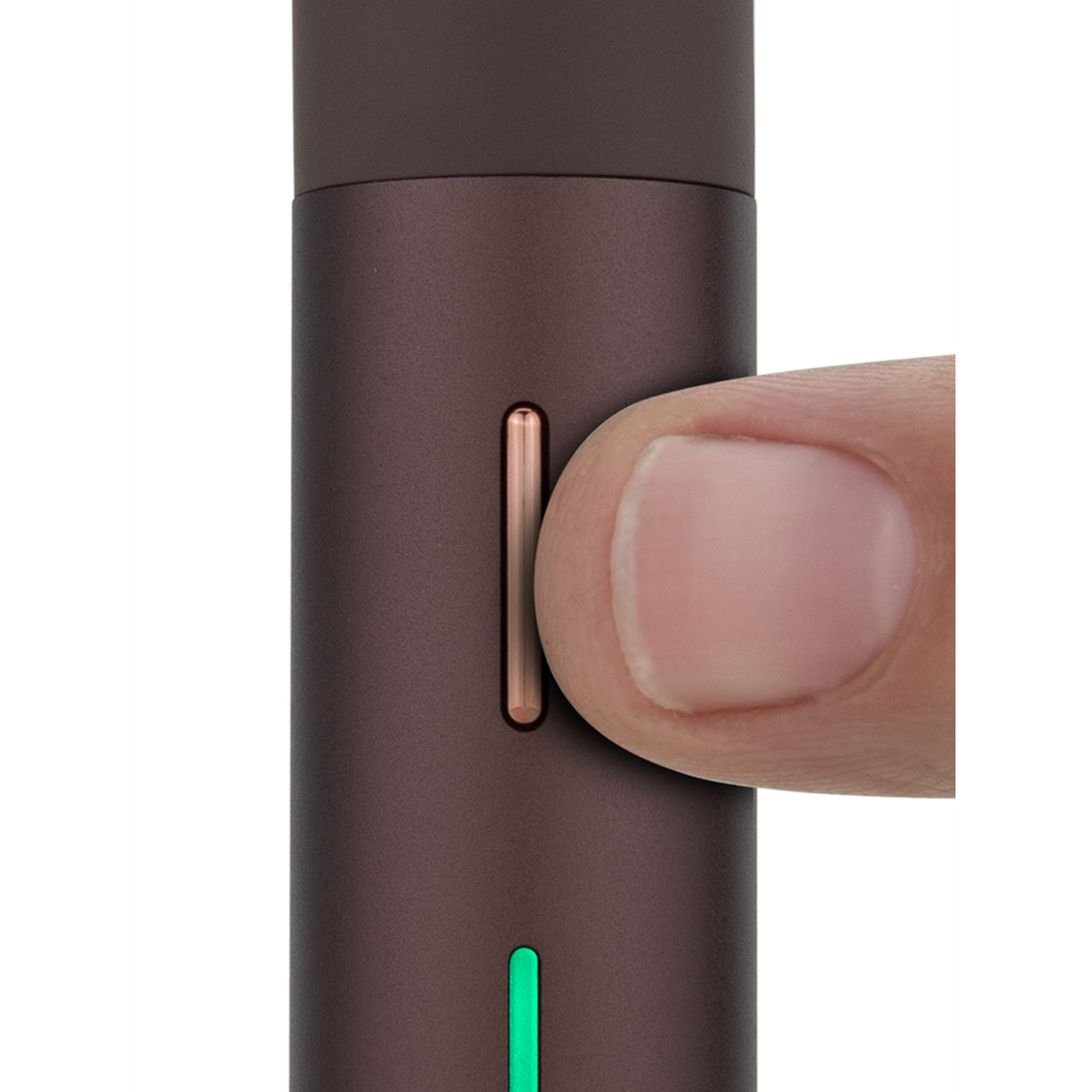 A thumb presses the copper button on the Puffco Pivot Electric Dab Pen, highlighting its slim green LED strip and compact design.