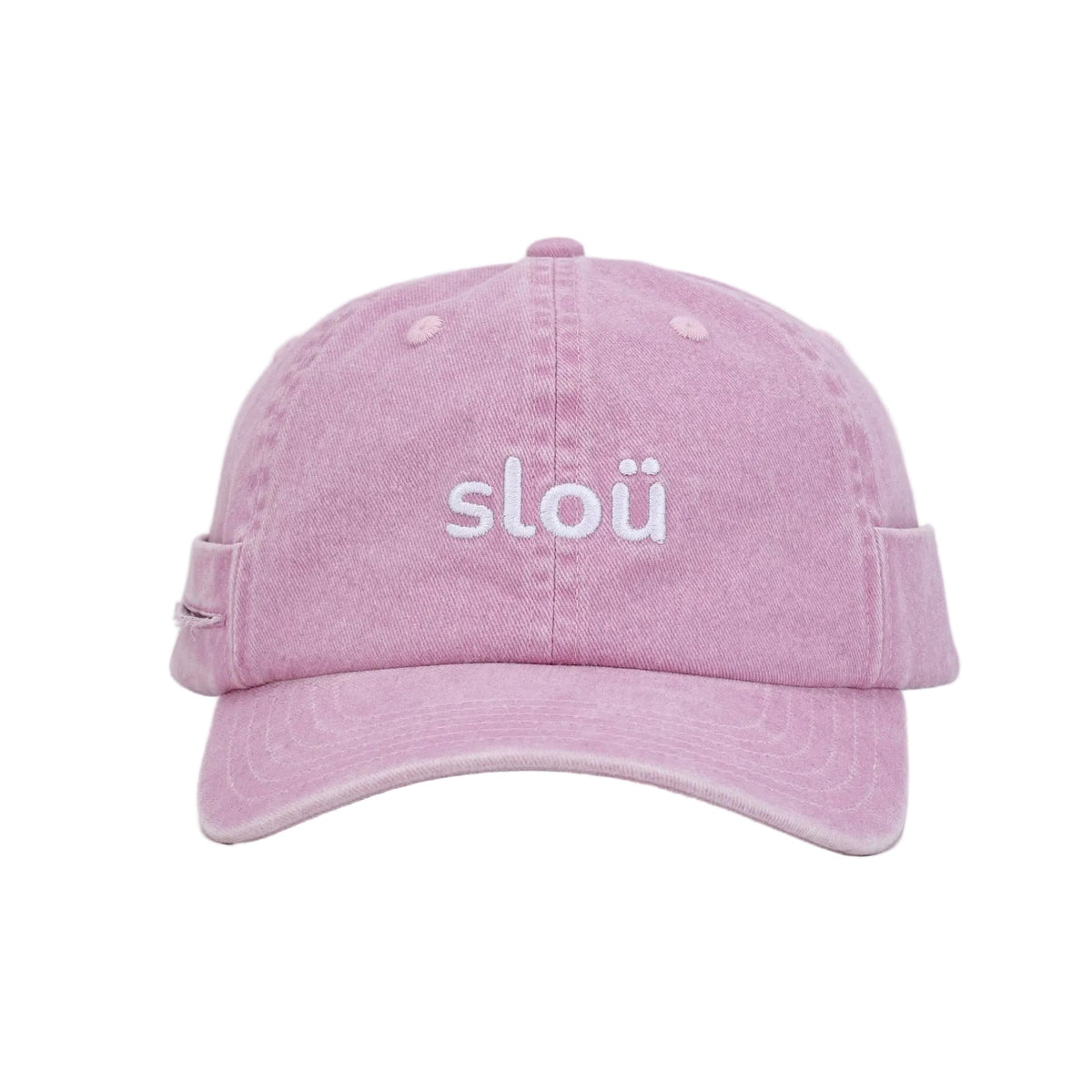 A light pink washed cotton rollers cap with the word slou embroidered in white across the front