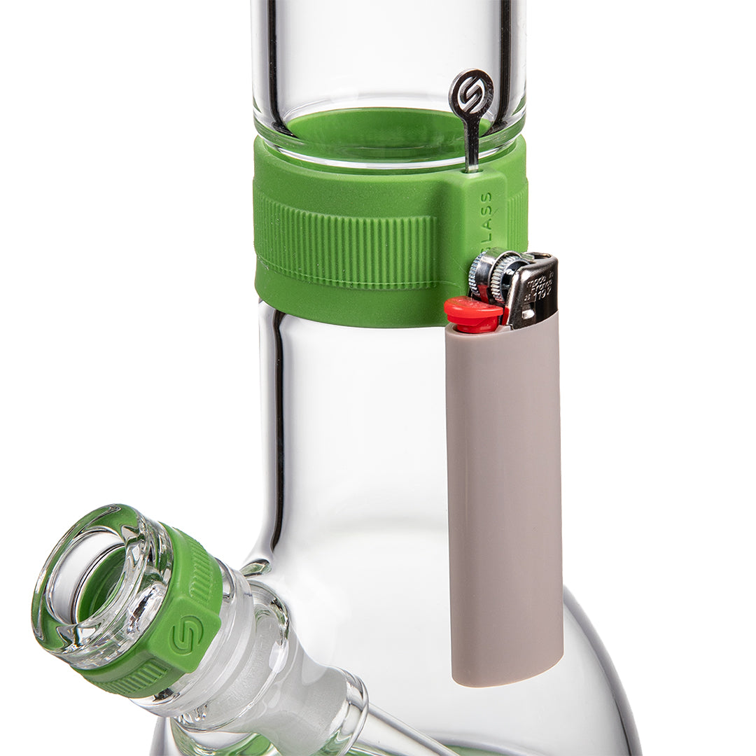 Green and clear glass bong with a lighter positioned beside the bowl, shown against a white background.