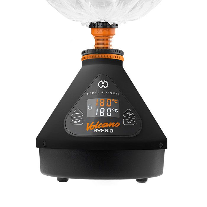 VOLCANO HYBRID Dry Herb Vaporizer with black pyramid base, digital display at 180°C, detachable clear balloon bag, dual-inhalation options, and touchscreen controls for precise vaporization.