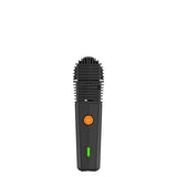 Handheld device with grated top, orange power button, green status LED; VEAZY Dry Herb Vaporizer by STORZ & BICKEL for portable precision and customization.