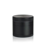 2.5 Multi Chamber Grinder - Black: A small, cylindrical, all-metal grinder with knurled bands for grip, featuring a four-piece modular design with a seam for separation.