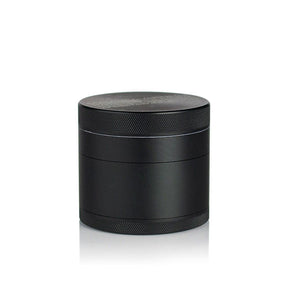 2.5 Multi Chamber Grinder - Black: A small, cylindrical, all-metal grinder with knurled bands for grip, featuring a four-piece modular design with a seam for separation.
