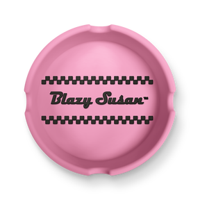 Classic Ashtray: A round silicone tray with black checker bands and Blazy Susan™ in bold script, designed for organizing small items.