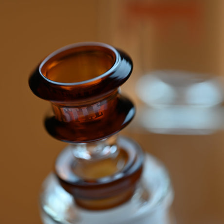 14 Glass Beaker Bong - Amber Logo, featuring robust borosilicate glass, thick base for stability, and elegant branding, offering durability and a smooth smoking experience.