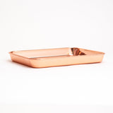 Stainless Steel Rolling Tray with a polished, copper-colored finish, showcasing a sleek, rectangular design for organizing essentials, set against a plain background.