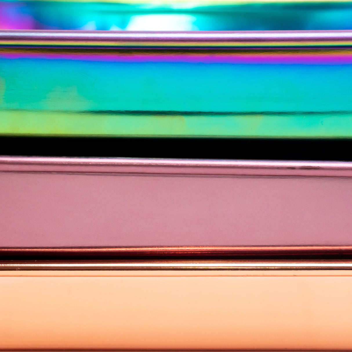 Stainless Steel Rolling Tray featuring reflective metal strips stacked horizontally, showcasing a sleek, durable design perfect for organizing essentials.