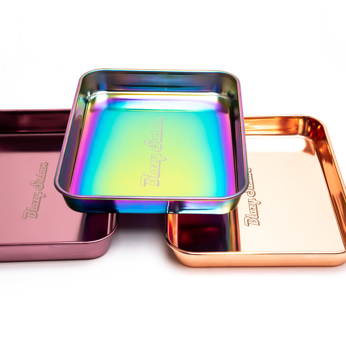Stainless Steel Rolling Tray set featuring three embossed, stackable trays with a rainbow-iridescent, rose-gold, and deep pink/purple finish, showcasing sleek, durable design.