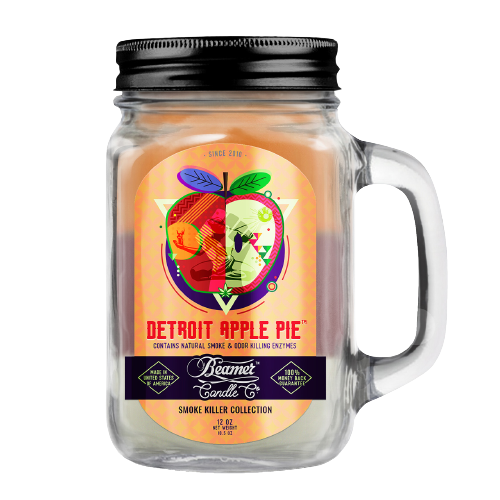 Scented Candle - Detroit Apple Pie in a glass jar with lid and apple design, featuring odor-eliminating enzymes and a 90-hour burn time.
