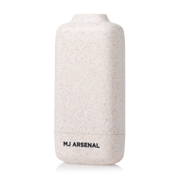 Houdini Smoke Filter by MJ Arsenal: Off-white speckled container with rounded corners, featuring a carbon filtration system for discreet odor elimination. Compact and portable design.