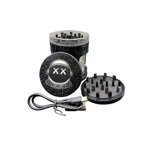 Earth Shaker Electric Herb Grinder & Dispenser disassembled: top lid with grinding teeth, middle chamber, magnetic bottom plate, USB charging cable shown alongside for visual context.