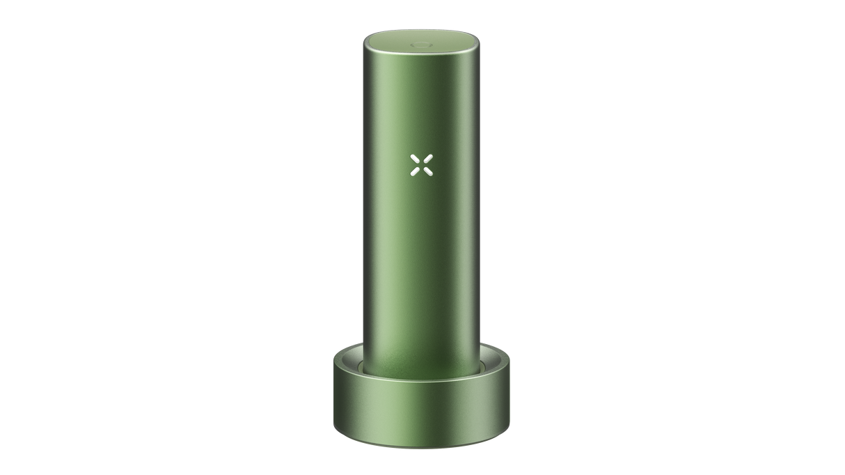 PAX FLOW vaporizer in olive-green sits in its matching charging dock, showcasing its X LED indicator, epitomizing advanced dry herb vaping technology.