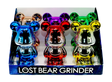 Countertop display box showcasing Grinder - Lost Bunny, featuring six metallic, cartoon-style bear herb grinders with chrome finishes, highlighting their compact, durable, and polished design.