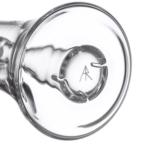 Lumina - Clear glass vessel with four swirl-inducers and a central maker’s mark, showcasing MJ Arsenal’s 14mm borosilicate glass bubbler design in collaboration with Andy Roth.