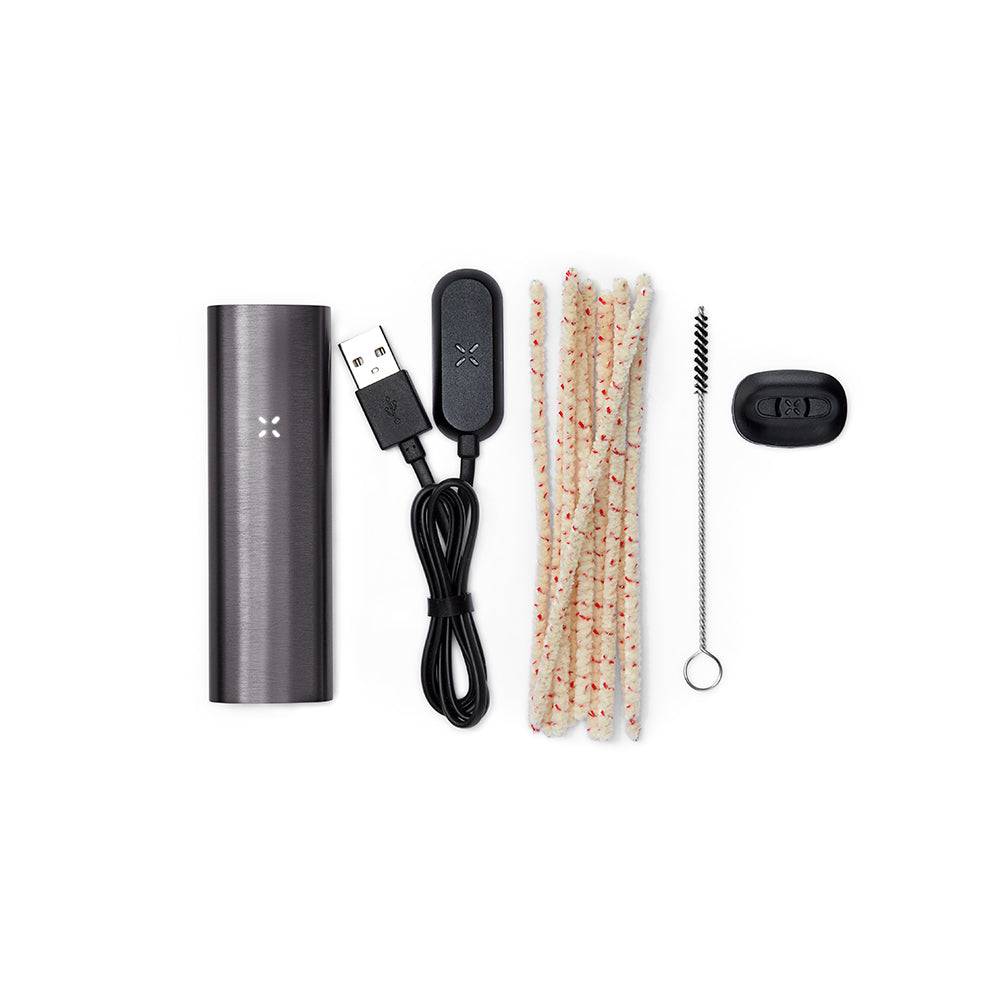 PAX 2 Dry Herb Vaporizer kit with vaporizer body, magnetic USB charger, cleaning tools, and extra mouthpiece, showcasing its sleek, portable design and user-friendly features.
