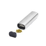 PAX 2 Dry Herb Vaporizer disassembled, showcasing the outer shell, removable oven lid, and a small pile of ground herbs ready for the heating chamber.