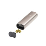 PAX 3 Basic Kit showing a compact vaporizer with an open magnetic mouthpiece, revealing its heating chamber and ground botanical material beside it.