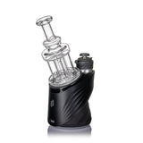 Quadra Peak Attachment: A compact e-rig vaporizer with a clear borosilicate glass bubbler, featuring a distinctive quad column design on a sculpted black base.