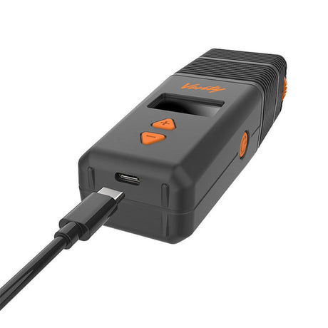 VENTY Dry Herb Vaporizer with orange buttons, featuring adjustable airflow and rapid heat-up, designed for superior vapor quality and convenience. Includes USB-C cable and accessories.
